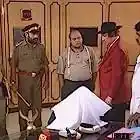 scene from Tehkikaat featuring Vijay Anand, Saurabh Shukla	